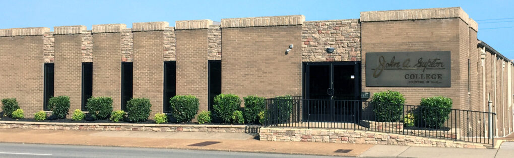 A photo of the front of the John A. Gupton campus building.