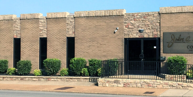 A photo of the front of the John A. Gupton campus building.